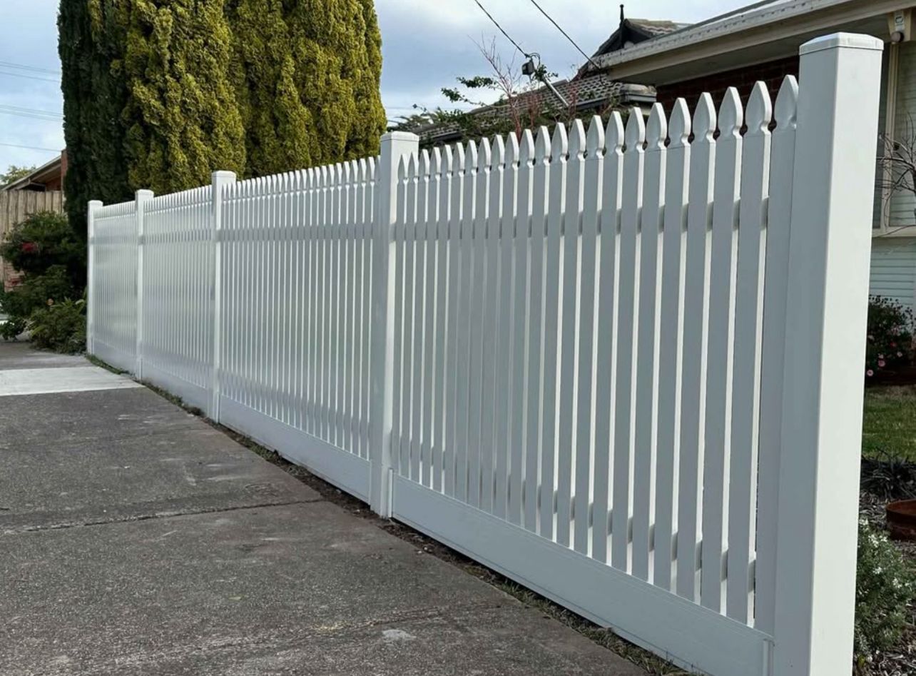 Classic scalloped white picket fence in Laverton